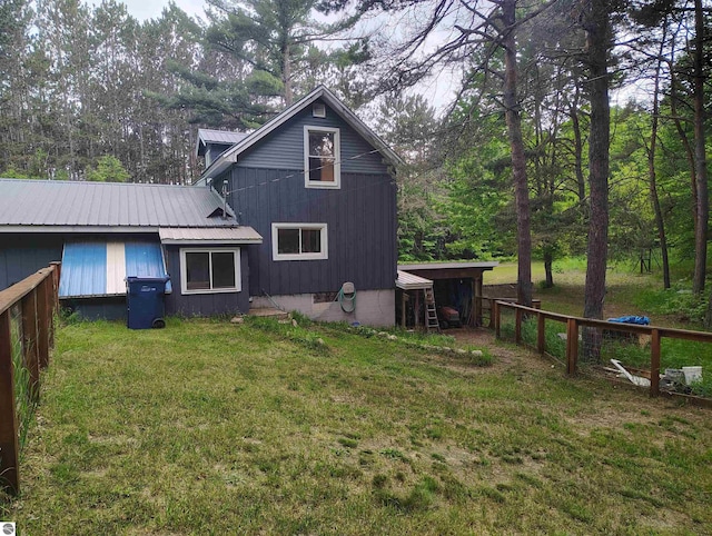 5094 SW Old Butler Rd Unit 1, South Boardman, MI 49680 - back of house featuring a metal roof