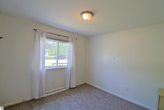 1220 E Gaylord St, Mount Pleasant, MI 48858 - unfurnished room featuring carpet flooring