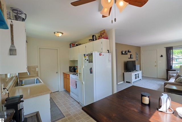 1220 E Gaylord St, Mount Pleasant, MI 48858 - kitchen with white appliances, a ceiling fan, light countertops, and white cabinets