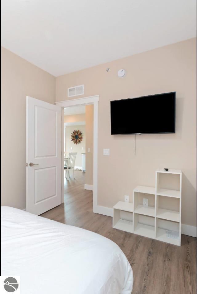 914-14 E Front St Unit 14, Traverse City, MI 49686 - bedroom featuring wood finished floors and baseboards
