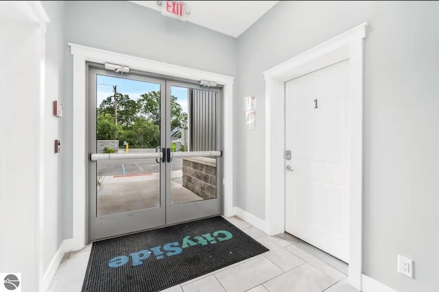 914-16 E Front St Unit 16, Traverse City, MI 49686 - foyer with light tile patterned flooring and french doors