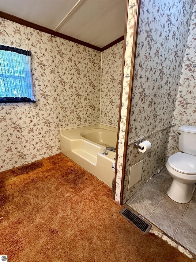 8334 Cinder Hill Rd, Mancelona, MI 49659 - bathroom with ornamental molding, wallpapered walls, a tub, and carpet floors