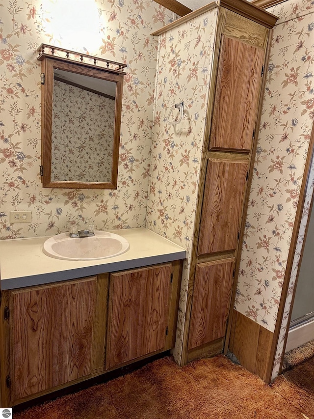 8334 Cinder Hill Rd, Mancelona, MI 49659 - bathroom with vanity and wallpapered walls