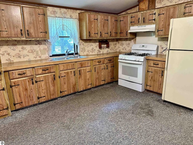 8334 Cinder Hill Rd, Mancelona, MI 49659 - kitchen featuring white appliances, under cabinet range hood, brown cabinets, lofted ceiling, and wallpapered walls