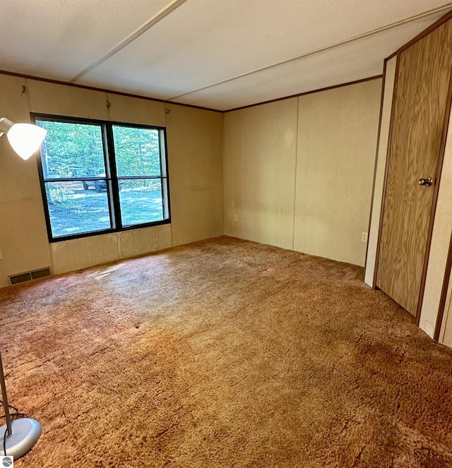 8334 Cinder Hill Rd, Mancelona, MI 49659 - unfurnished room featuring carpet floors