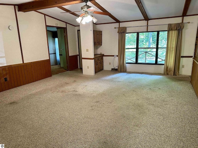 8334 Cinder Hill Rd, Mancelona, MI 49659 - carpeted spare room featuring wainscoting, a ceiling fan, and wooden walls