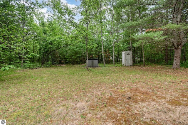 7373 Blue Ox Trl, South Branch, MI 48761 - view of green lawn with a storage shed
