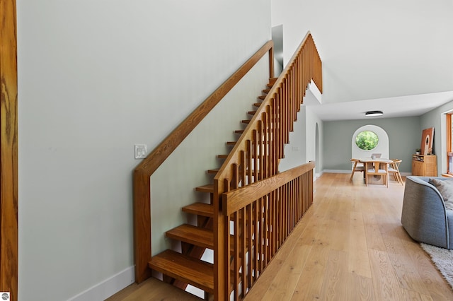 4340 E Huron River Dr, Ann Arbor, MI 48105 - stairs with baseboards and wood finished floors
