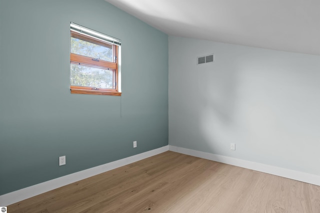 4340 E Huron River Dr, Ann Arbor, MI 48105 - spare room with wood finished floors and lofted ceiling
