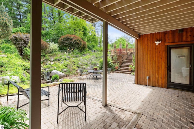 4340 E Huron River Dr, Ann Arbor, MI 48105 - view of patio / terrace featuring stairway and outdoor dining area