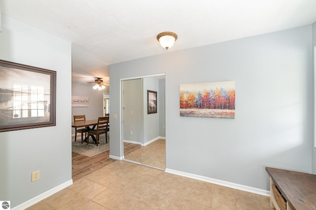7746 Five Lakes Dr, Farwell, MI 48622 - hallway featuring baseboards and light tile patterned floors