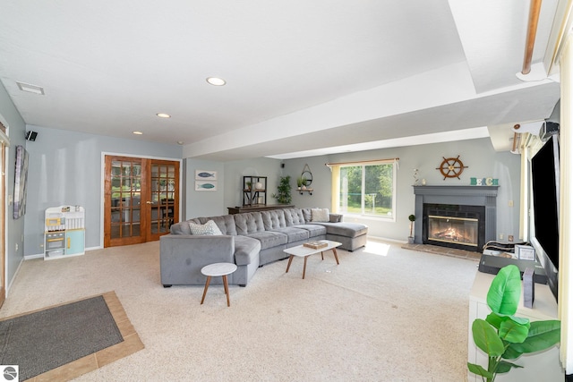 7746 Five Lakes Dr, Farwell, MI 48622 - carpeted living room with a glass covered fireplace, french doors, and recessed lighting