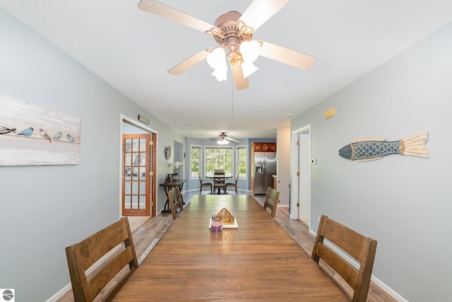 7746 Five Lakes Dr, Farwell, MI 48622 - dining space featuring a ceiling fan and light wood-type flooring