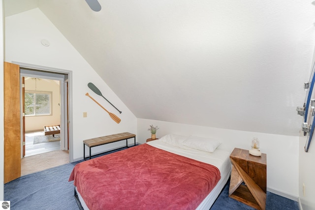 7746 Five Lakes Dr, Farwell, MI 48622 - carpeted bedroom with vaulted ceiling and ceiling fan