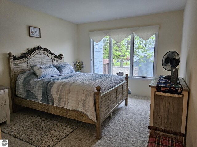 407 W Lake St Unit 45, Tawas City, MI 48763 - bedroom with light carpet