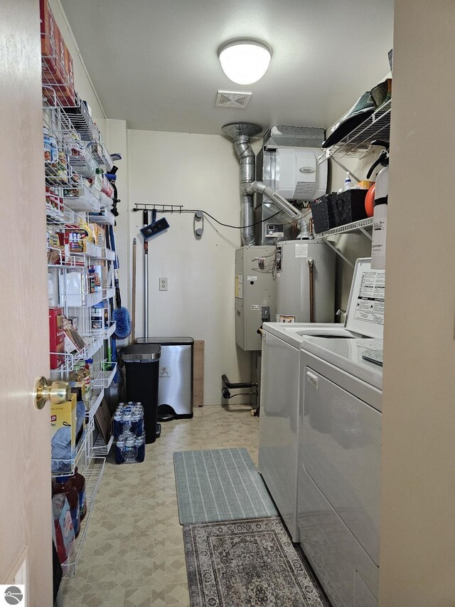 407 W Lake St Unit 45, Tawas City, MI 48763 - laundry room with independent washer and dryer and tile patterned floors