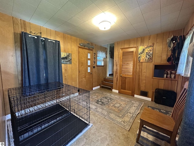 501 W 13th St, Cadillac, MI 49601 - entryway featuring wooden walls and stairway