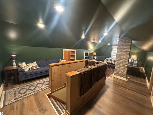 501 W 13th St, Cadillac, MI 49601 - home theater featuring ornate columns, lofted ceiling, and wood finished floors