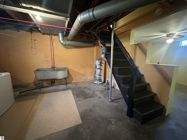 501 W 13th St, Cadillac, MI 49601 - unfinished below grade area featuring stairway and gas water heater