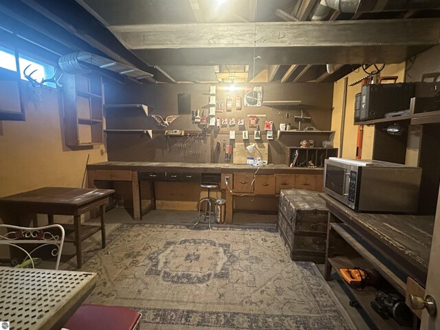 501 W 13th St, Cadillac, MI 49601 - unfinished basement featuring a workshop area