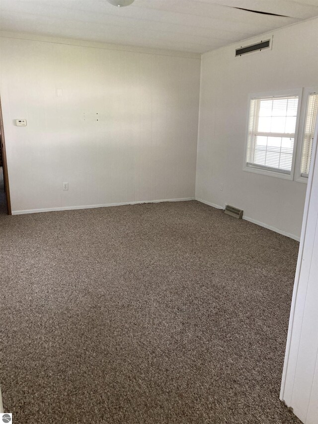 4510 W Country Way, Saginaw, MI 48603 - spare room featuring carpet flooring and baseboards