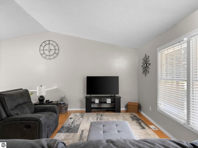 1708 Ketha Dr, Cadillac, MI 49601 - living room with lofted ceiling and wood finished floors