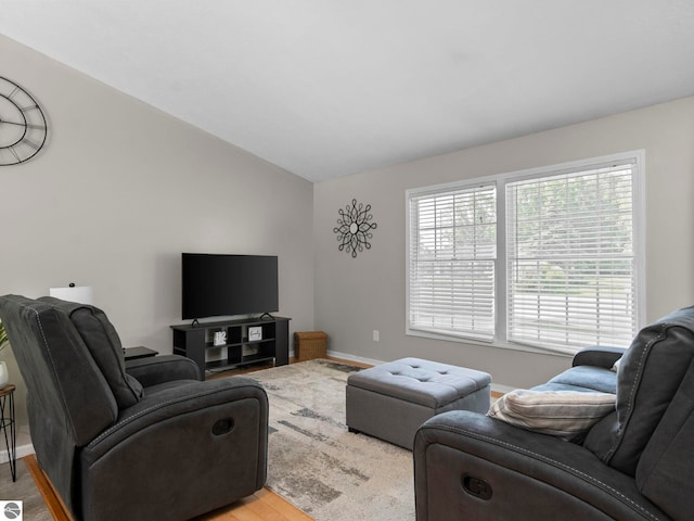 1708 Ketha Dr, Cadillac, MI 49601 - living area featuring vaulted ceiling and baseboards