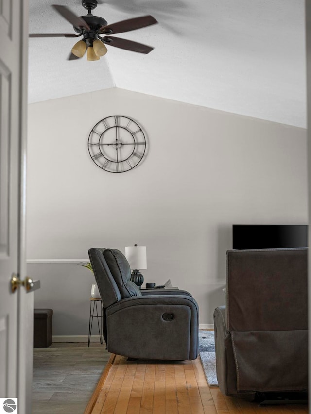 1708 Ketha Dr, Cadillac, MI 49601 - living area featuring a ceiling fan and wood finished floors