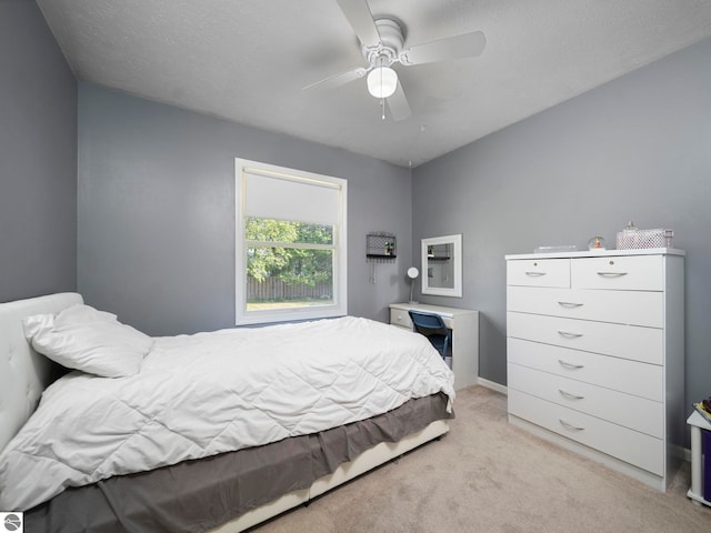 1708 Ketha Dr, Cadillac, MI 49601 - bedroom with light carpet and ceiling fan