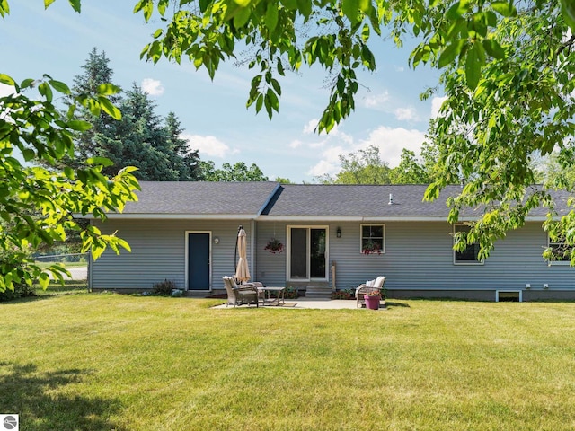1708 Ketha Dr, Cadillac, MI 49601 - back of property featuring a patio area and entry steps