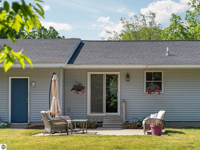 1708 Ketha Dr, Cadillac, MI 49601 - rear view of property with entry steps, a yard, roof with shingles, and a patio