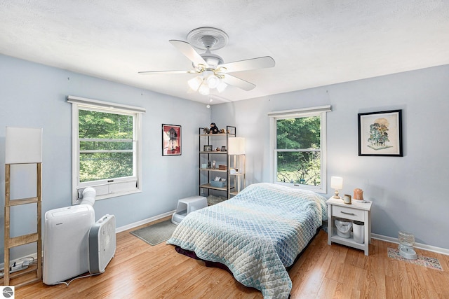 2902 N Dr, Traverse City, MI 49685 - bedroom with wood finished floors and ceiling fan