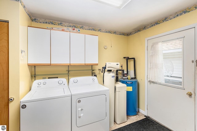 2902 N Dr, Traverse City, MI 49685 - laundry room featuring washing machine and dryer and cabinet space