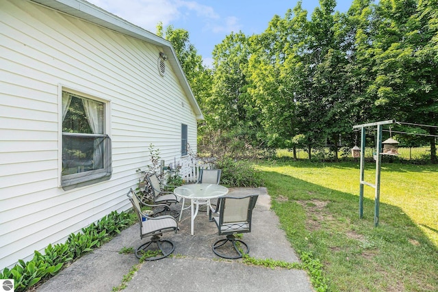 2902 N Dr, Traverse City, MI 49685 - view of green lawn featuring a patio area