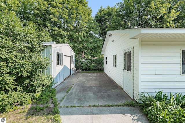 2902 N Dr, Traverse City, MI 49685 - view of property exterior with a patio