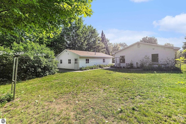 2902 N Dr, Traverse City, MI 49685 - back of property with a yard