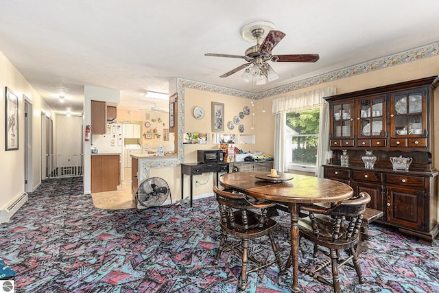 2902 N Dr, Traverse City, MI 49685 - dining space featuring a ceiling fan and carpet floors