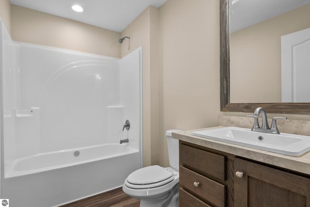 3874 Falling Leaf Trl, Traverse City, MI 49686 - full bath featuring vanity, tub / shower combination, and wood finished floors