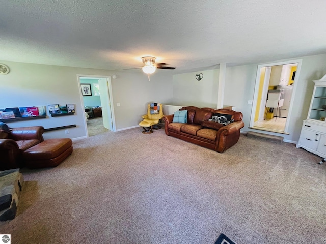801 N Bridge St, Bellaire, MI 49615 - living room featuring carpet, a ceiling fan, and a textured ceiling