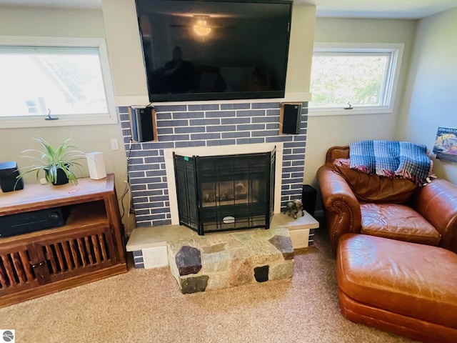 801 N Bridge St, Bellaire, MI 49615 - living area with carpet flooring and a tile fireplace