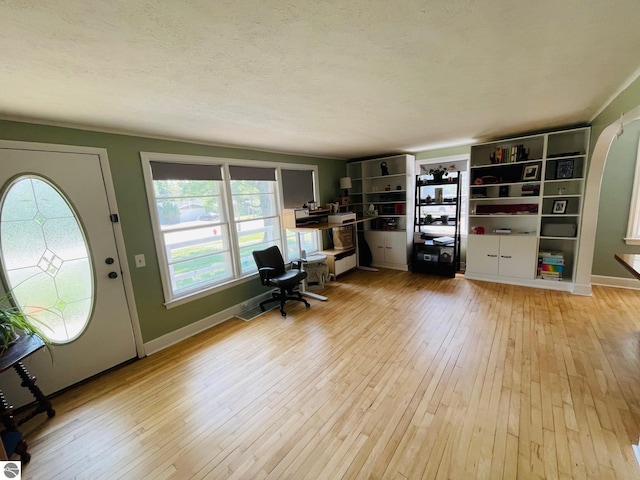 801 N Bridge St, Bellaire, MI 49615 - office with light wood-style floors and a textured ceiling