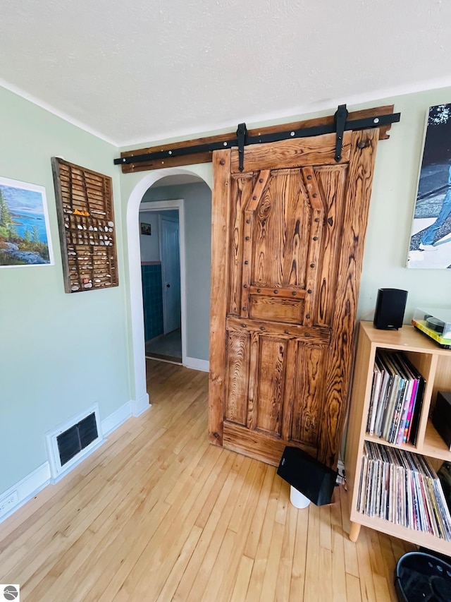 801 N Bridge St, Bellaire, MI 49615 - detailed view of arched walkways and wood finished floors