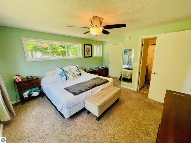 801 N Bridge St, Bellaire, MI 49615 - carpeted bedroom with a textured ceiling and ceiling fan