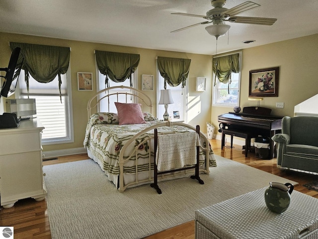 1005 W Lake St Unit 4, Tawas City, MI 48763 - bedroom featuring wood finished floors and ceiling fan