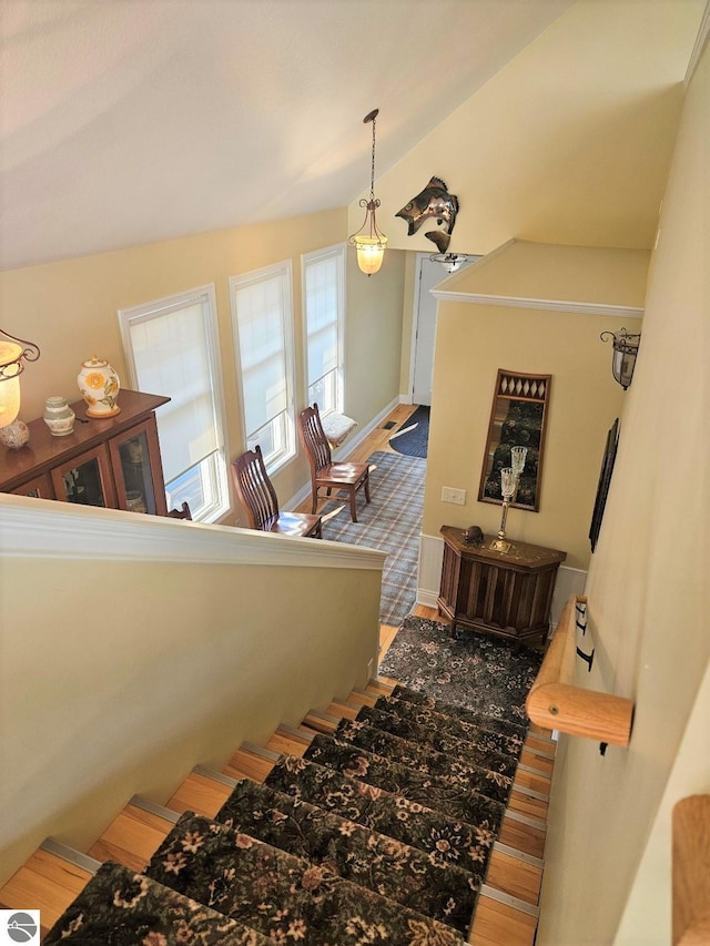 1005 W Lake St Unit 4, Tawas City, MI 48763 - stairs with wood finished floors and lofted ceiling