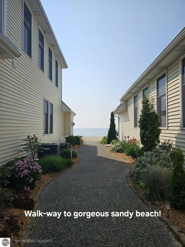 1005 W Lake St Unit 4, Tawas City, MI 48763 - view of home's exterior with a water view