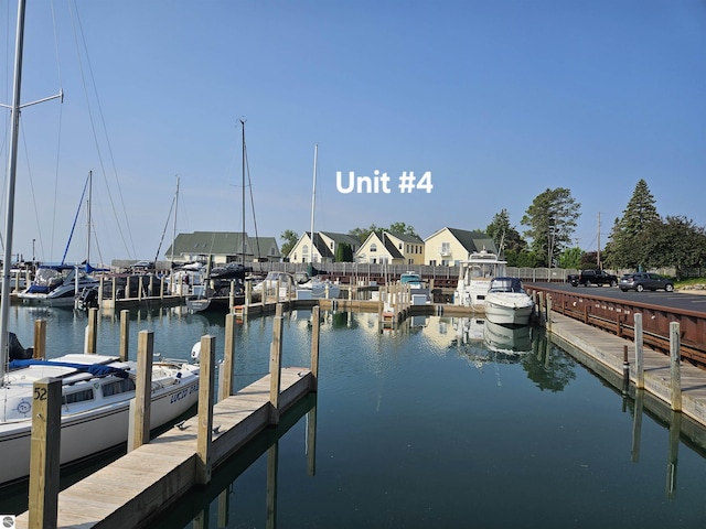 1005 W Lake St Unit 4, Tawas City, MI 48763 - dock area featuring a water view