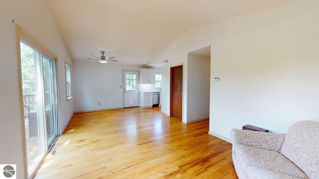 7500 Five Lakes Dr, Farwell, MI 48622 - living area featuring light wood-type flooring, ceiling fan, and vaulted ceiling