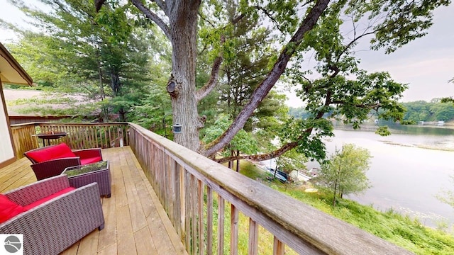7500 Five Lakes Dr, Farwell, MI 48622 - wooden deck with a water view