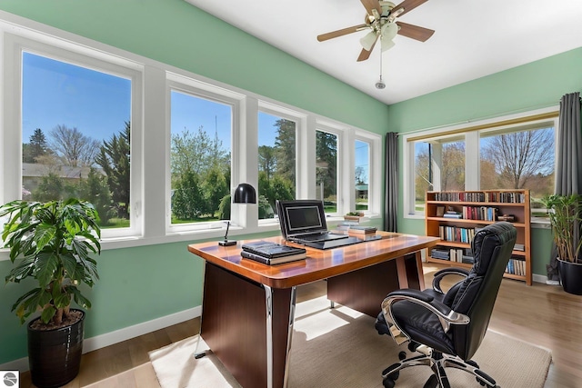 301 Pearl St, Kingsley, MI 49649 - office area with wood finished floors and ceiling fan
